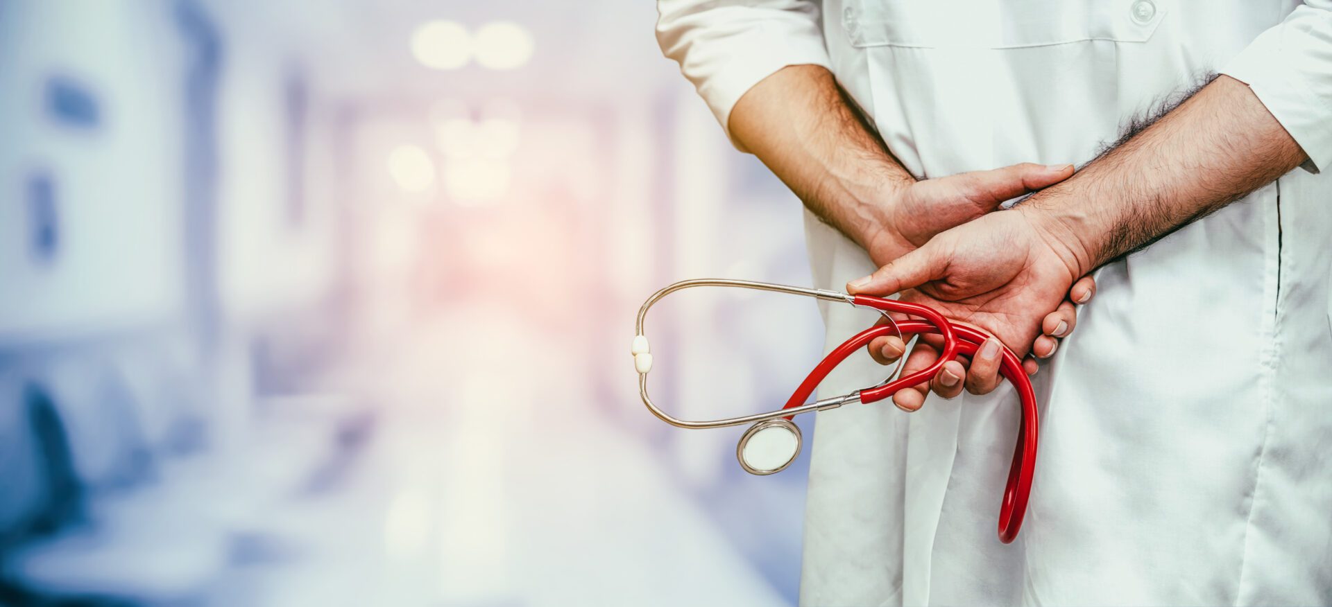 Young male doctor working at the hospital. Medical healthcare and doctor staff service.